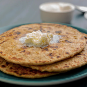 Whole Wheat Pyaj Paratha With Curd